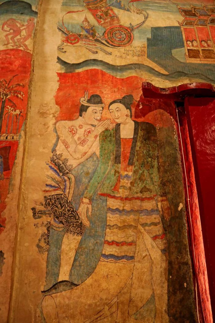 Mural man whispering woman worshiping hall wat phumin temple nan