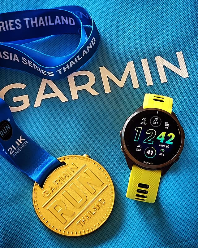 garmin smartwatch with medal and lanyard from thailand running event