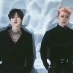 A photo of 2 men wearing black outfits