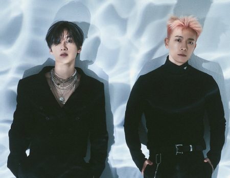 A photo of 2 men wearing black outfits