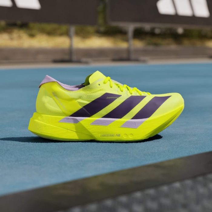 Adidas Adizero Adios Pro 4 yellow running shoe on track