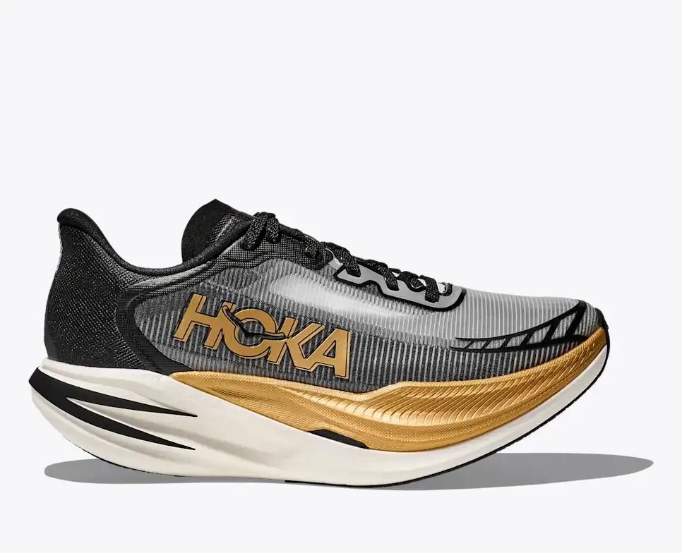 Hoka black and gold road running shoe