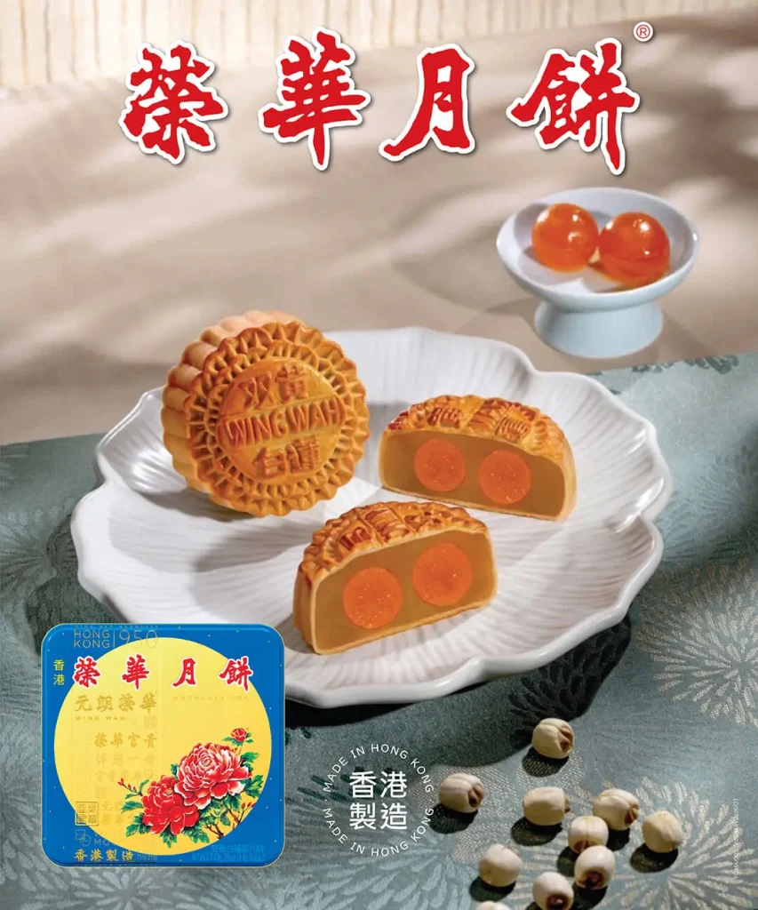 Wing Wah traditional mooncakes with egg yolk on plate, Mid-Autumn Festival
