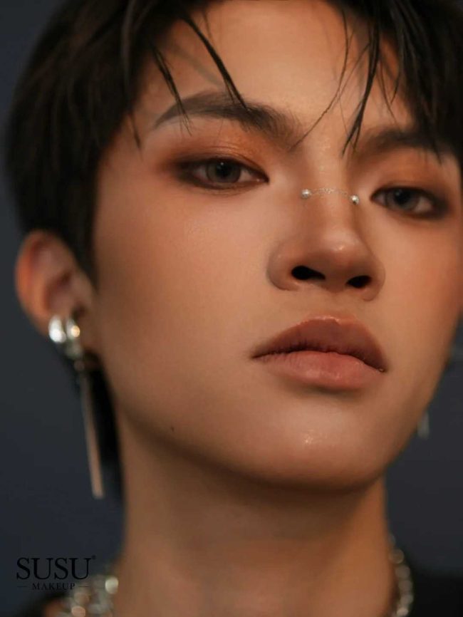 A photo of men with earrings
