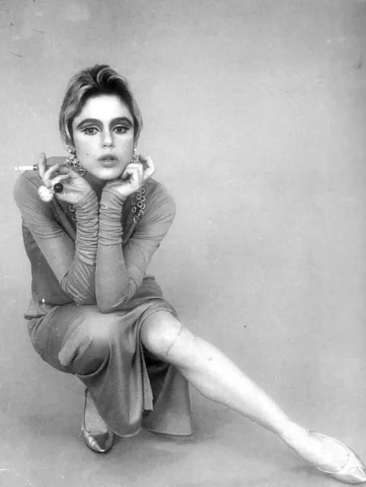 Black and white photo of a women posing for a camera